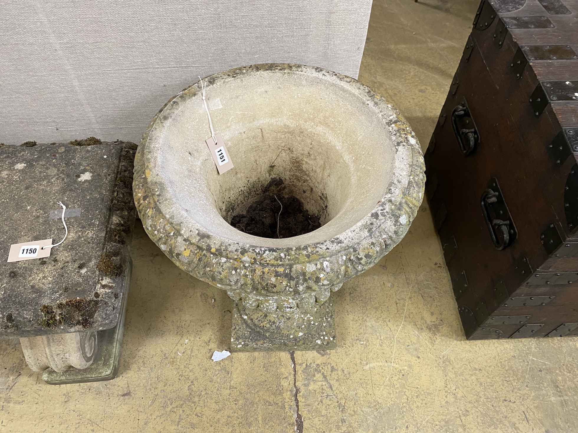 A circular reconstituted stone campana garden urn, diameter 50cm, height 64cm